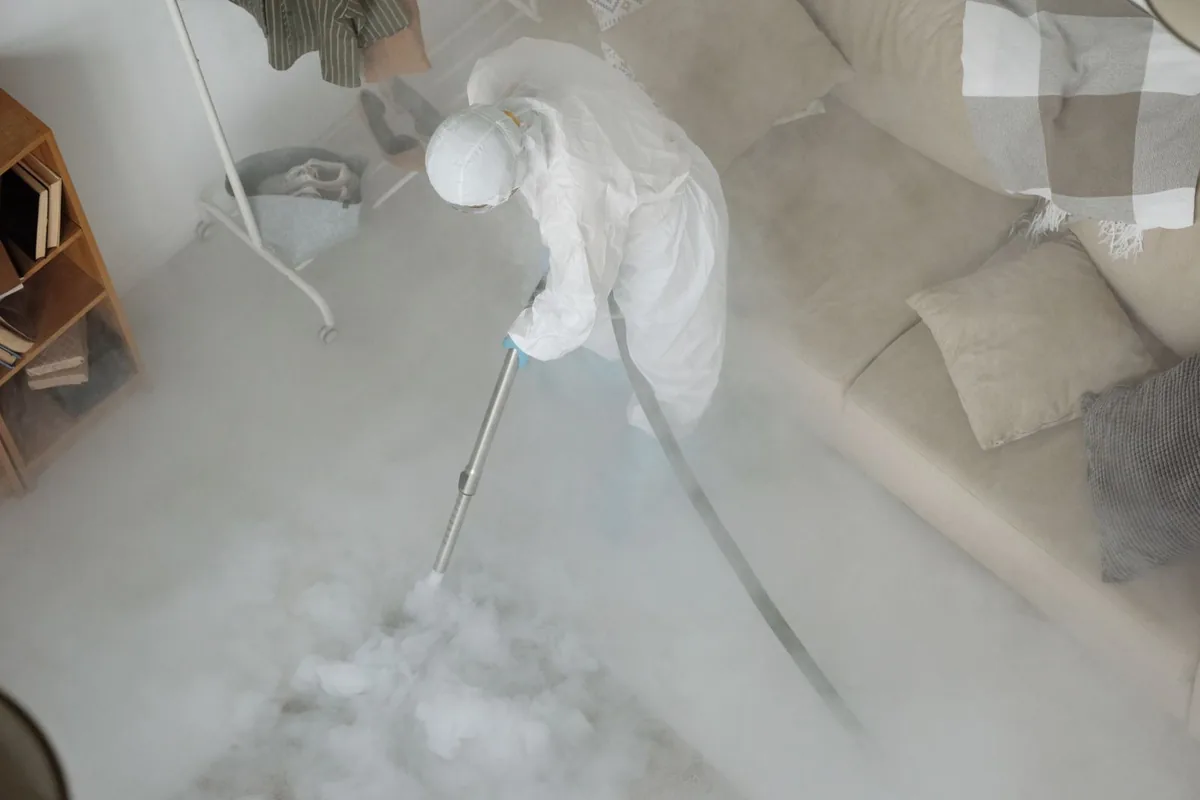 Biohazard cleanup technician in protective equipment, Greene, IA